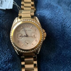 Michael Kors watch gold with diamond accents around watch face